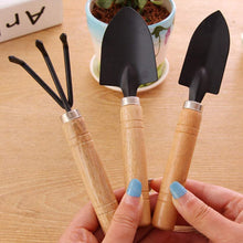 Hand cultivator and trowel set, small garden fork included, perfect for garden care.