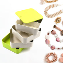 4-layer rotating jewelry box for organizing earrings and accessories.