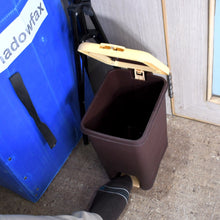 Trash can with step-on pedal