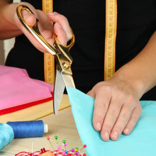 Tailoring scissors with sharp blades, suitable for fabric cutting.