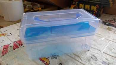 Plastic storage case with handle, designed for various uses including art supplies and fishing gear.